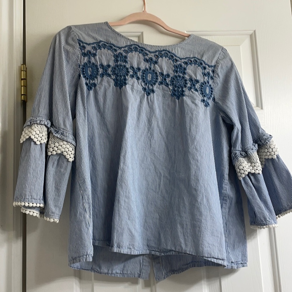 blue and white bell sleeved shirt